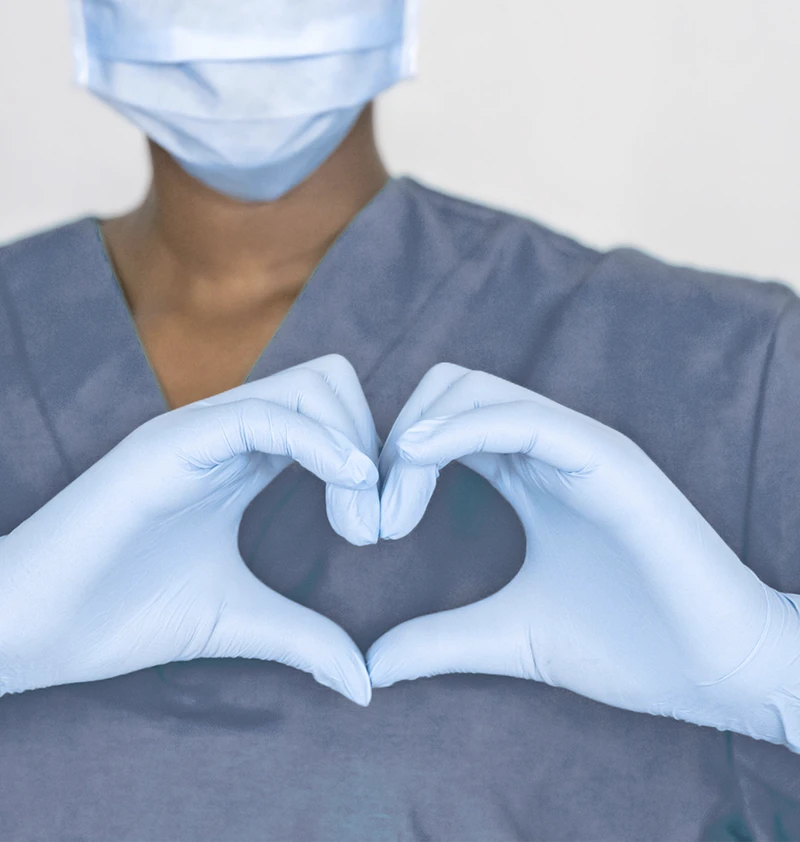 Nurse making a heart shape